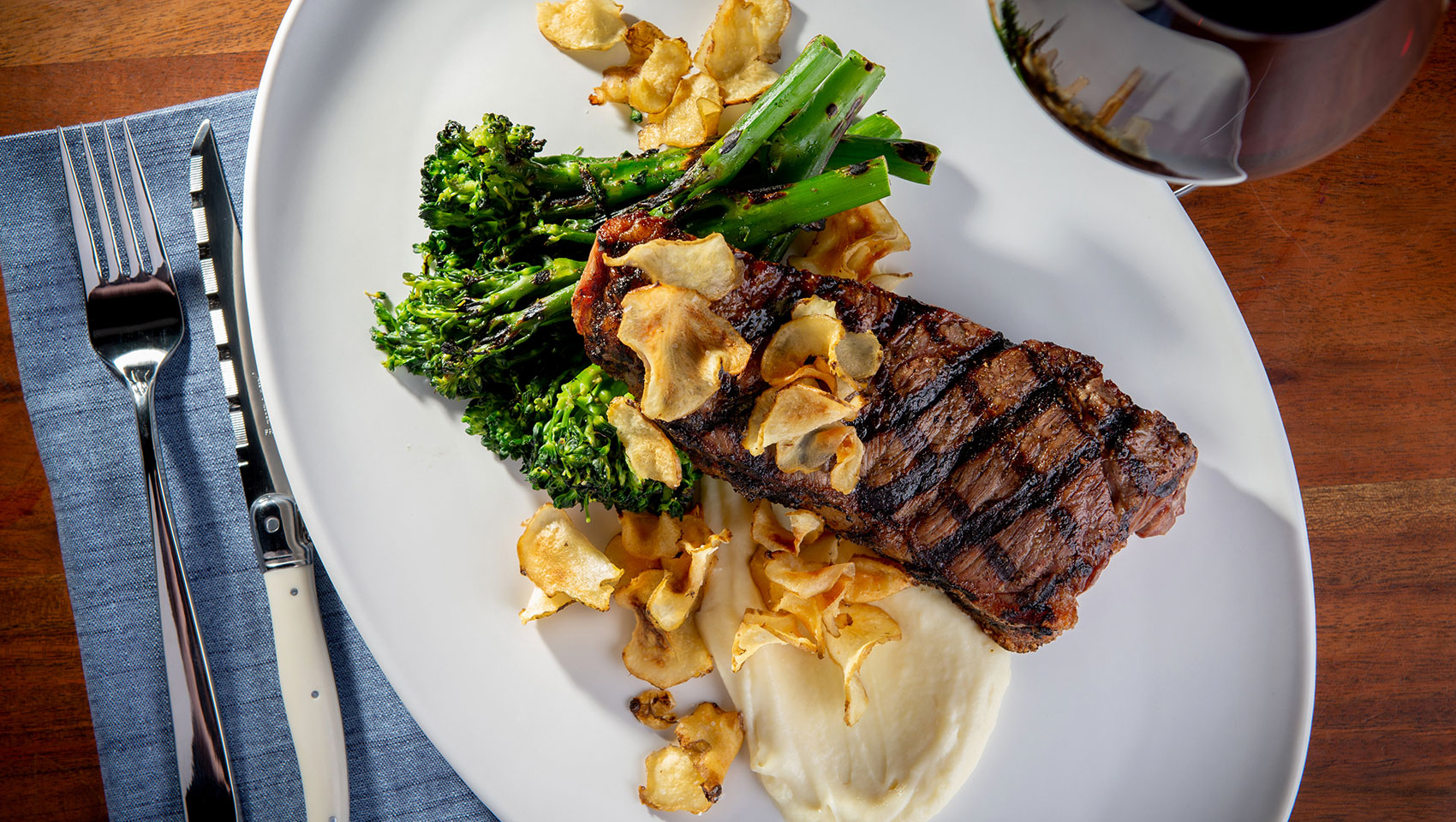 plated steak entrée with wine