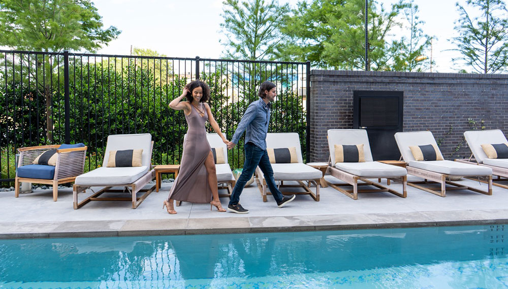 couple walking by pool