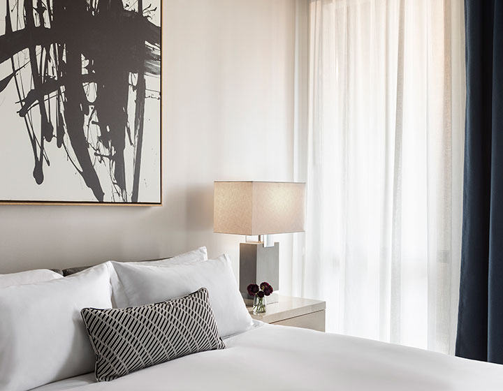 The Kimpton Pittman Hotel  guestroom and side table