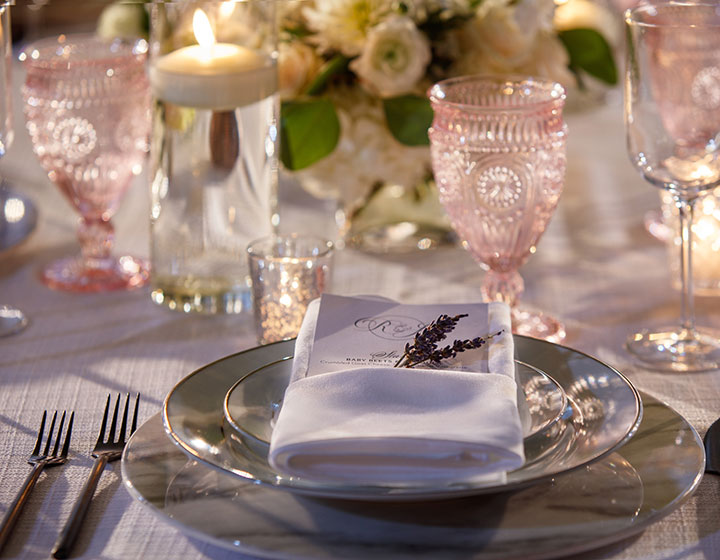wedding reception table with flowers and candles